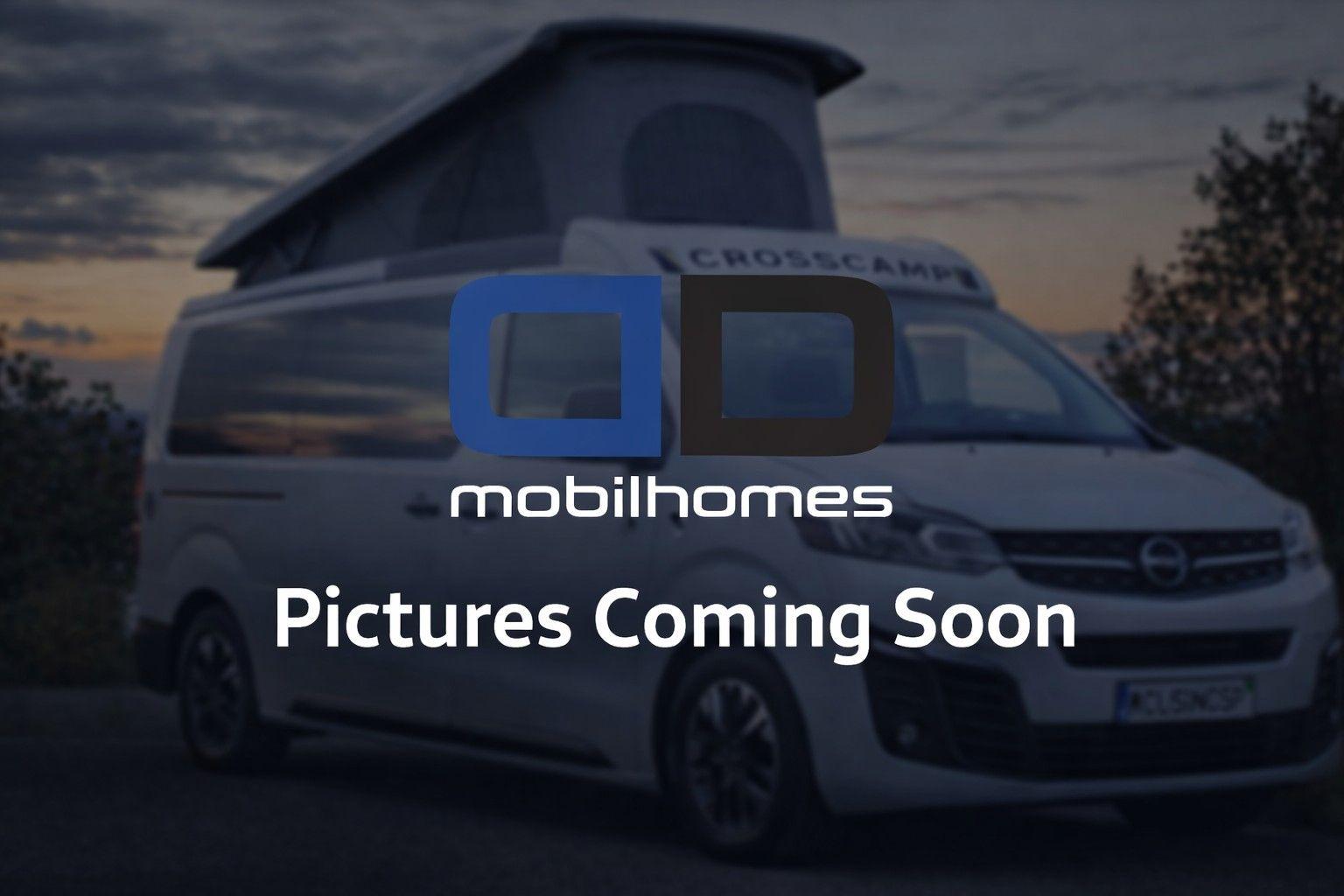 White camper van with a large blue/black 'mobilhomes' logo and the caption 'Pictures Coming Soon'.